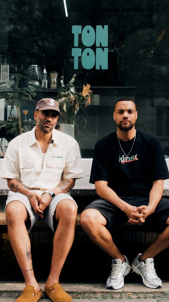 Jonas and Gilbert, the founders, on the bench outside Café TonTon.