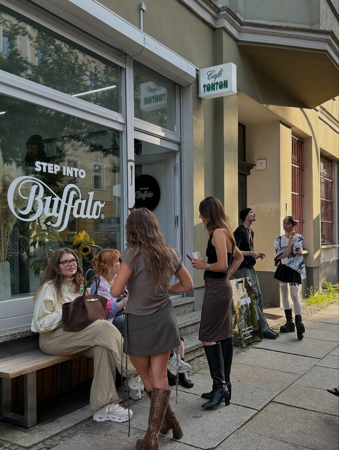 Guests outside the shopfront with the Step into Buffalo window decal